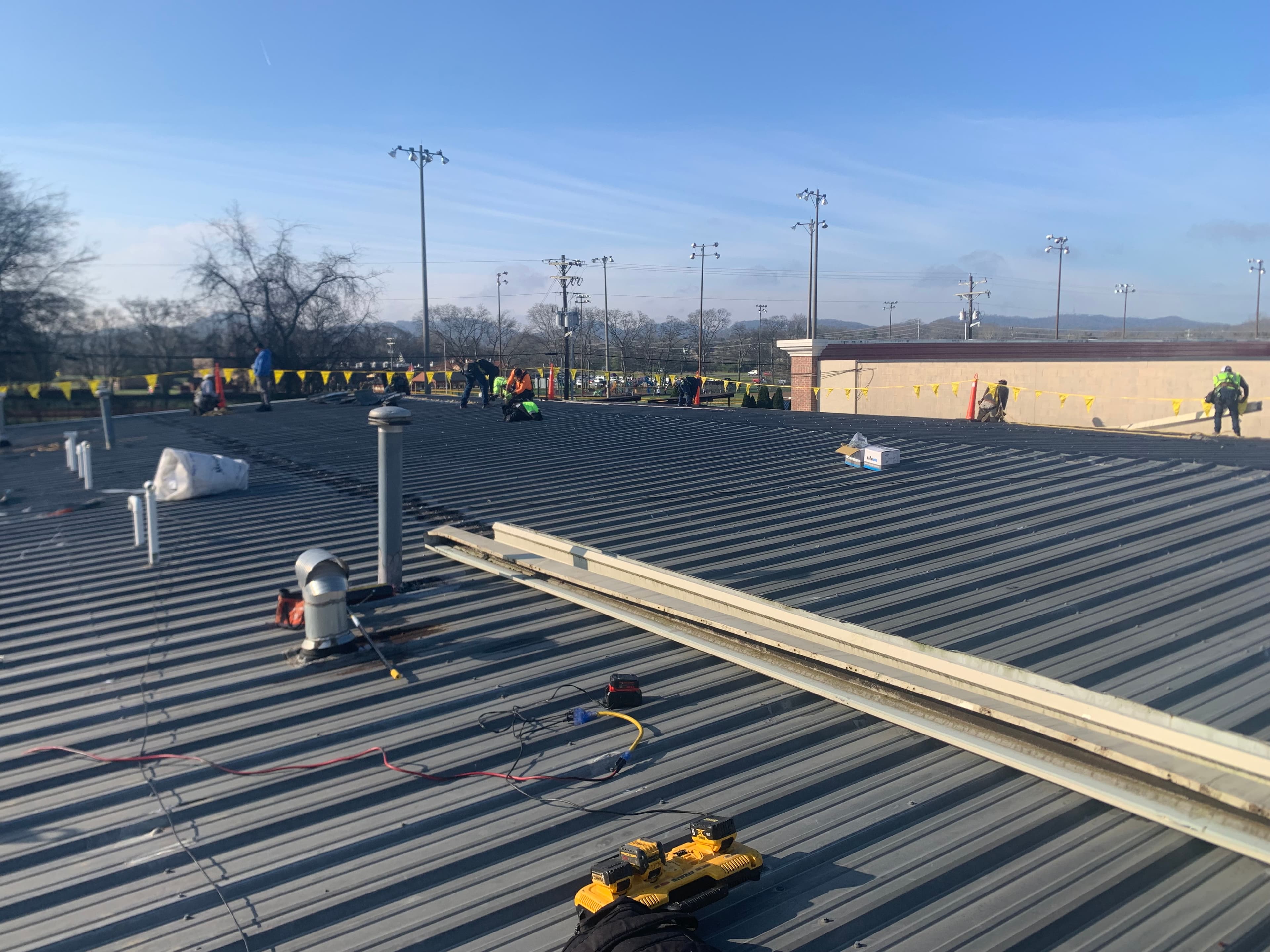 UAB medical-district commercial roofing - HVAC-curb-dense roof systems with careful clinical-hour coordination