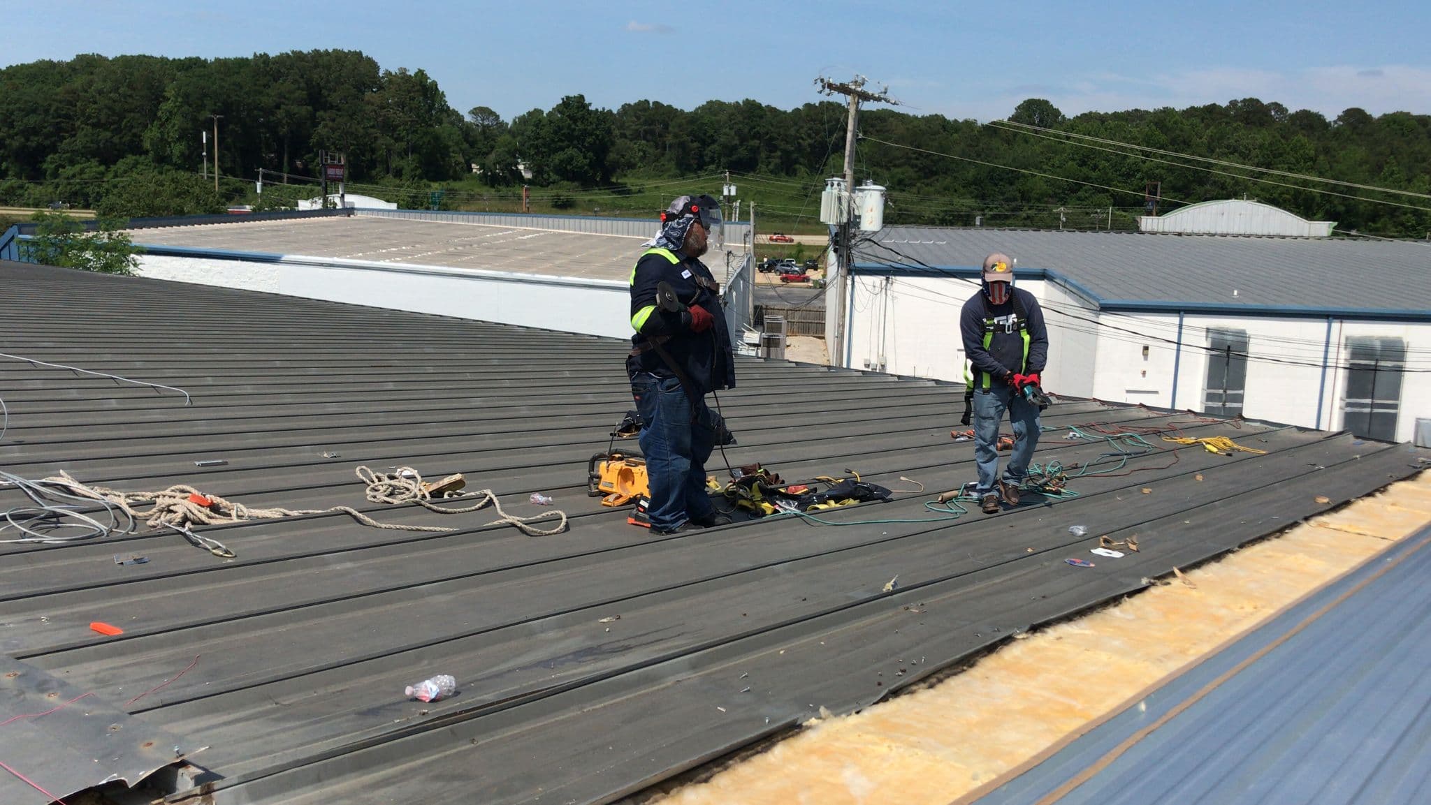 Georgia multifamily roof replacement - tenant-in-place phasing across Buford Highway and Vinings multifamily stock