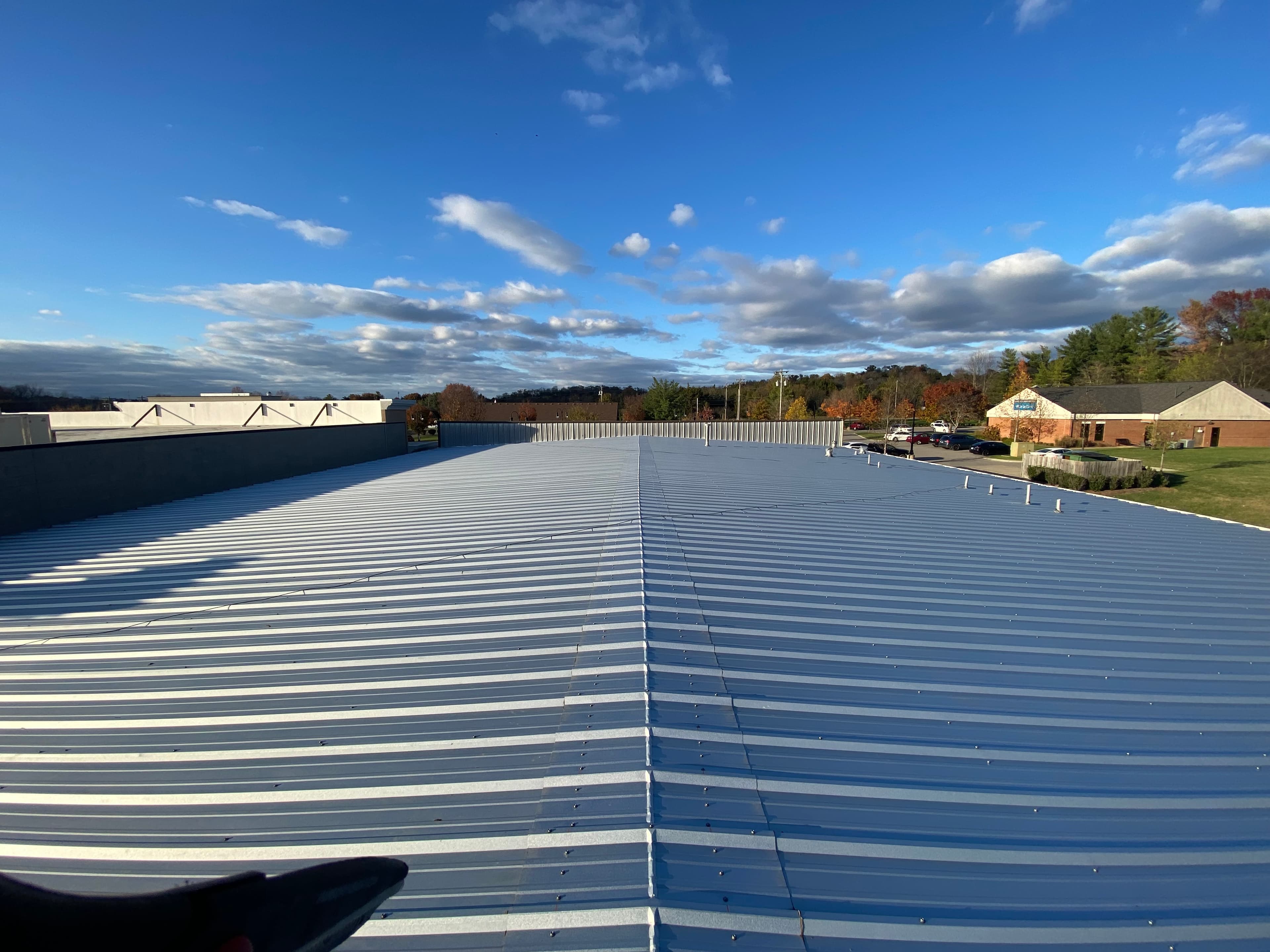 Commercial roofing Johns Creek GA - Emory Johns Creek Hospital, Technology Park office, Medlock Bridge multifamily coverage in North Fulton