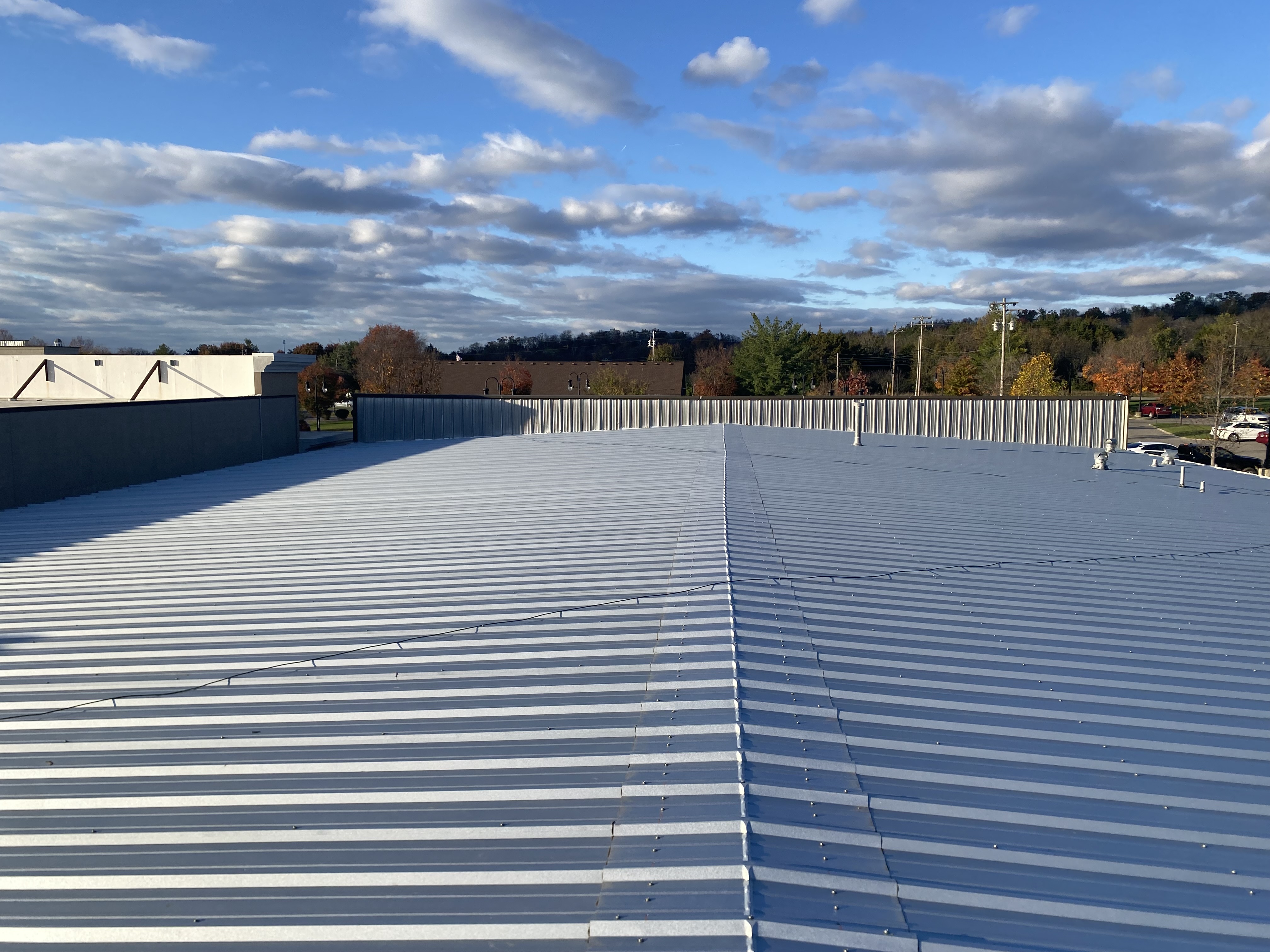 Multifamily roof replacement in progress - phased production with tenants in place across a garden-style Southeast property