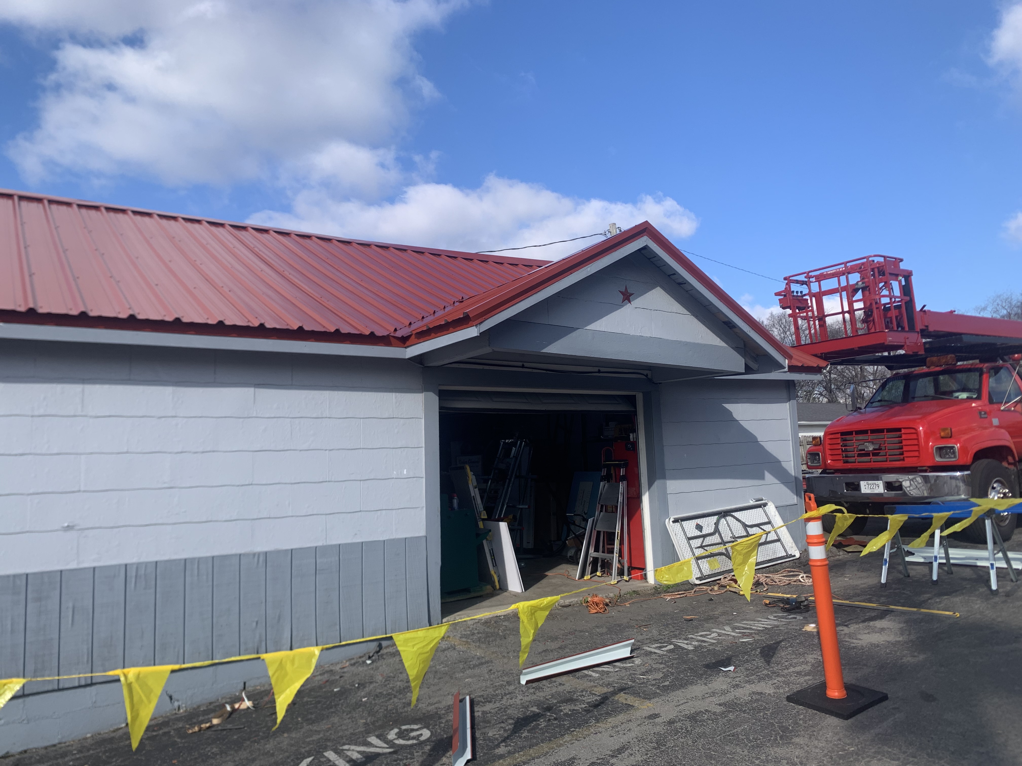 Clay tile roofing on a commercial hospitality property - authentic Mediterranean profile with enhanced wind-uplift detailing for Gulf Coast exposure